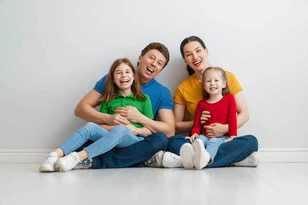 Happy loving family. Mother, father and children daughters on white background.  - Foto, Imagem