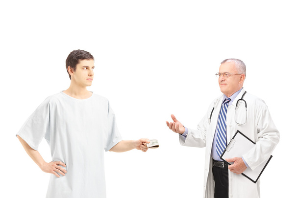 Male patient offering bribe to doctor - Foto, imagen