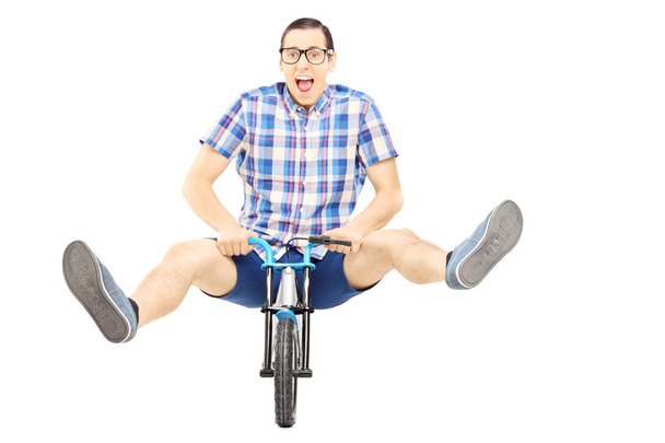 Crazy man on small bicycle - Zdjęcie, obraz