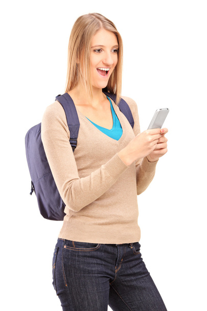 Excited female holding mobile phone - Фото, зображення