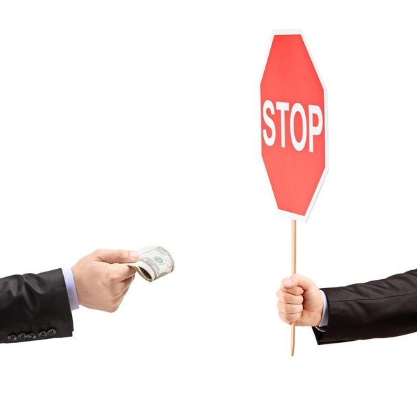 Man with stop sign saying no to bribery - Zdjęcie, obraz