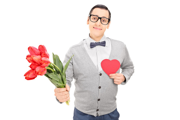 Guy holding heart and flowers - Foto, Imagem