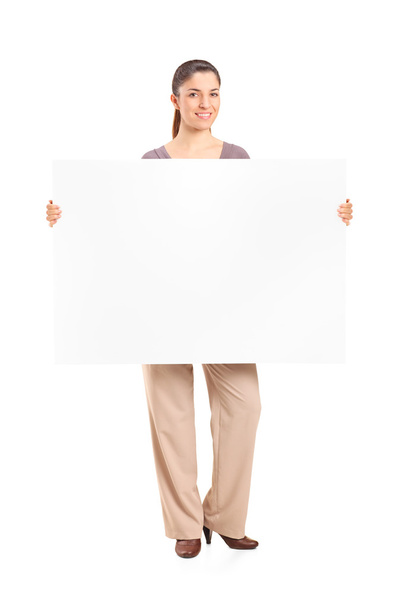 Woman holding blank billboard - 写真・画像