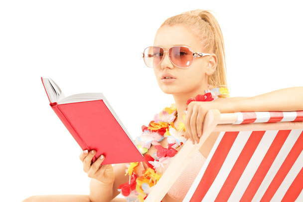 Blond female reading - Фото, изображение