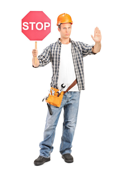 Construction worker holding stop sign - Zdjęcie, obraz
