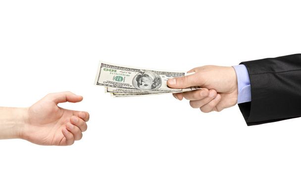 Hand handing money to another hand - Фото, зображення