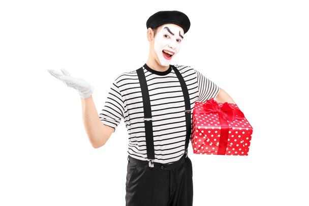 Male mime artist holding gift box - Фото, зображення