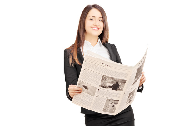 Businesswoman holding newspaper - Zdjęcie, obraz