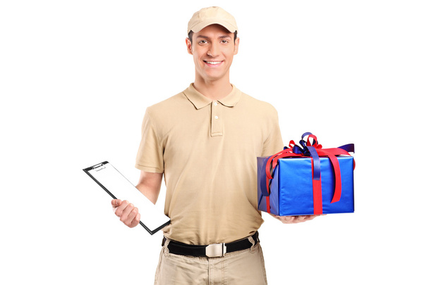 Delivery person delivering gift box - Zdjęcie, obraz