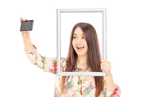 Woman taking a selfie - Фото, зображення