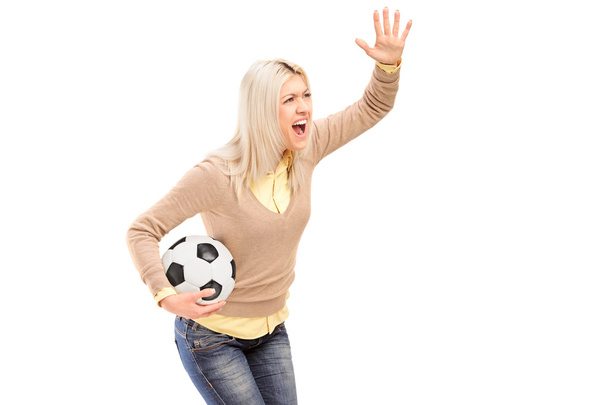 Female sport fan holding football - Фото, изображение