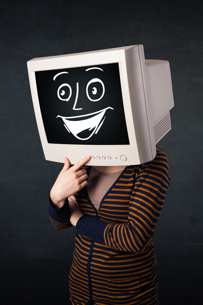 Girl with a monitor head and a cheerful cartoon face - Fotó, kép