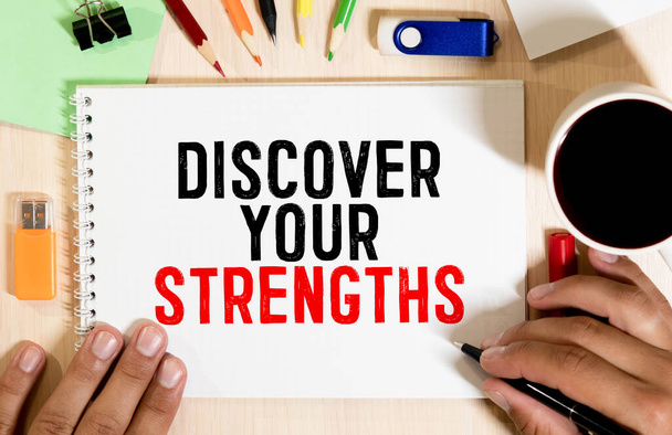 Discover your strengths- business concept of entrepreneur management message on wood background with paper clips. - Photo, Image