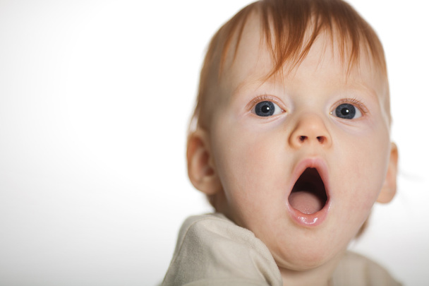 Little funny red haired boy yawns - Photo, Image
