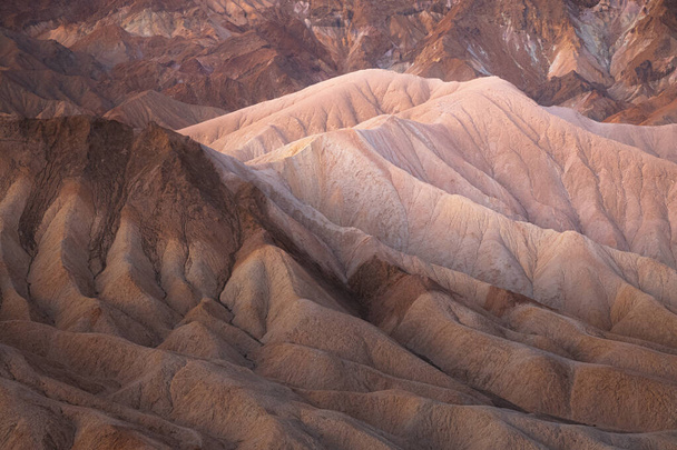 Detail texture of the rugged sedimentary rock terrain of the badlands landscape in Death Valley Park National Park, USA. - Photo, Image