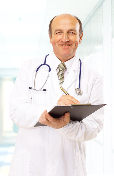 Doctor with stethoscope isolated on white background - Фото, изображение
