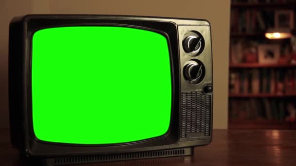 TV Set with Green Screen in Living Room. Zoom In. You can replace green screen with the footage or picture you want. You can do it with Keying effect in After Effects or any other video editing software (check out tutorials on YouTube).  - Footage, Video