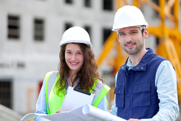 Portrait of co-workers on a construction site - Zdjęcie, obraz