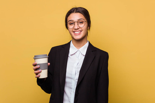 Young indian business woman drinking a takeaway coffee isolated - Foto, Imagem