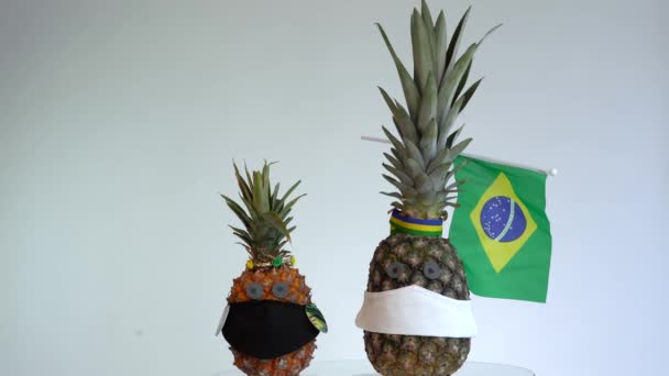 The pineapple wears a face mask. concept of crisis coronavirus (COVID-19). Copy space. - Footage, Video