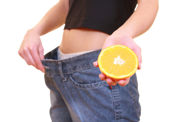 oranžové břicho a velký džíny - úbytek hmotnosti izolované na bílém - Fotografie, Obrázek