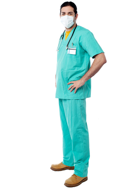 Experienced surgeon with hands on his waist - Фото, зображення