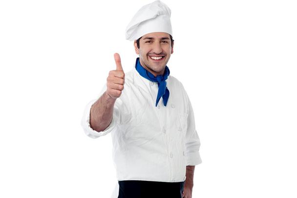 Young chef showing double thumbs up - Foto, immagini