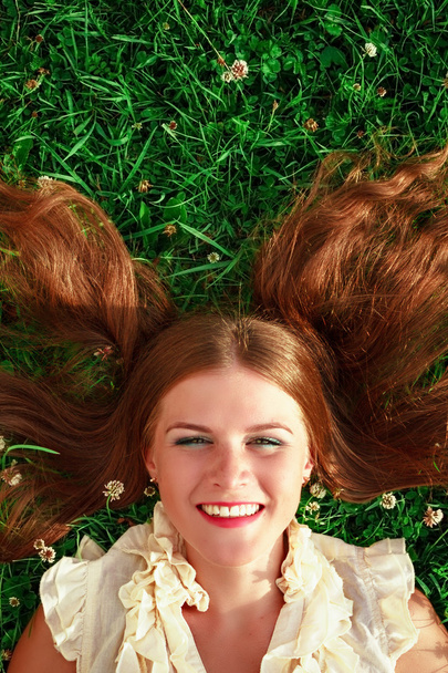 Cute redhead female lying down - Zdjęcie, obraz