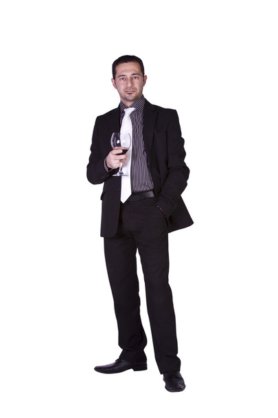 Businessman celebrating with a glass of drink - Zdjęcie, obraz