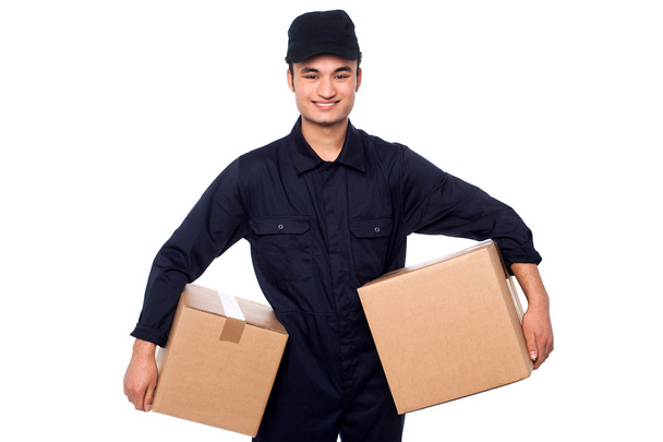 Young courier guy holding boxes - Photo, Image