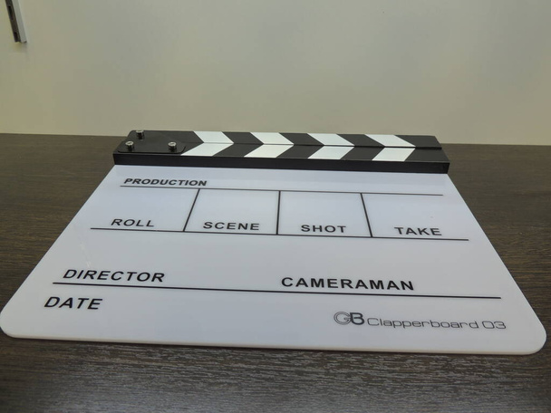 Clapperboard black-white, glossy macro. Cinematic equipment. The background. For the audio track. - Photo, Image