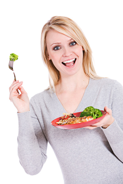 Choices: Smiling Woman With Brocolli On Fork - Φωτογραφία, εικόνα