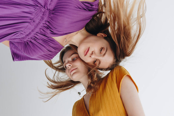 Minimalistic Fashion Portrait Of Two Girls On White Background - Foto, Imagem