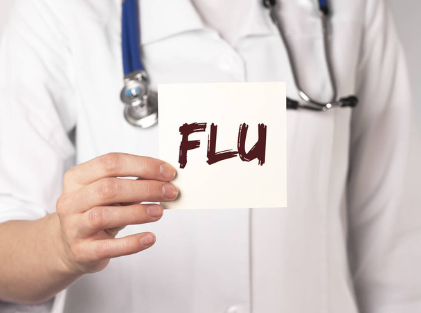 Flu word, inscription in doctor hands. Medical concept. - Foto, immagini