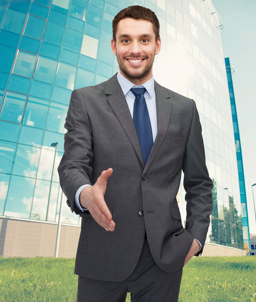 Businessman with open hand ready for handshake - Photo, Image