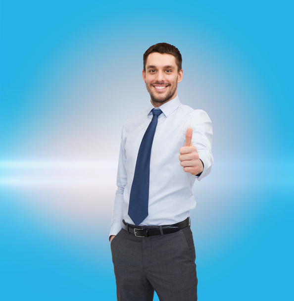 Handsome businessman showing thumbs up - Photo, Image