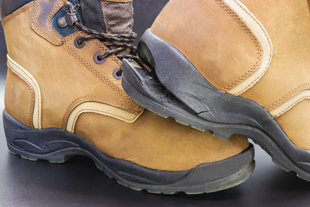 Torn men's leather shoes. Torn shoe sole. Shoe repair. Close-up - Photo, Image