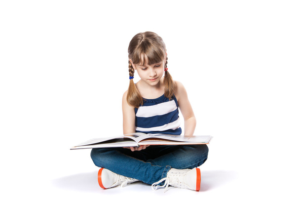girl reading a book on white background - Zdjęcie, obraz
