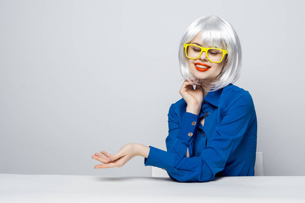 cheerful woman with red lips in a white wig gesturing with her hands yellow glasses  - Photo, Image