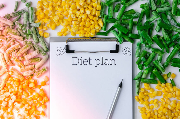 DIET plan. Frozen vegetables food of yellow corn, green beans. Harvest Food preservation for winter. Veganism, vegetarian healthy eating, Empty copy space for text - Photo, Image