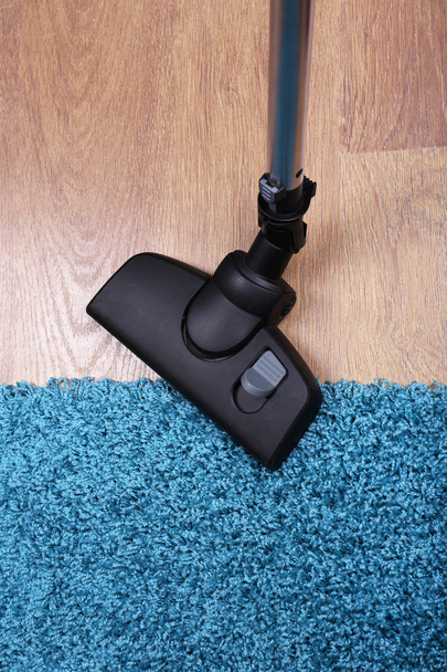 Vacuuming carpet in house - Φωτογραφία, εικόνα