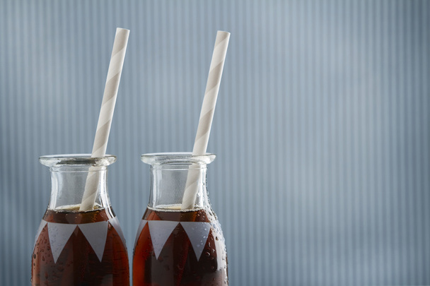 Vintage cola drink bottles with straws and copy space - Photo, Image