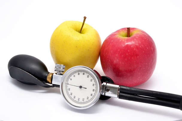 Apfel mit Blutdruckmessgerät - Foto, Bild
