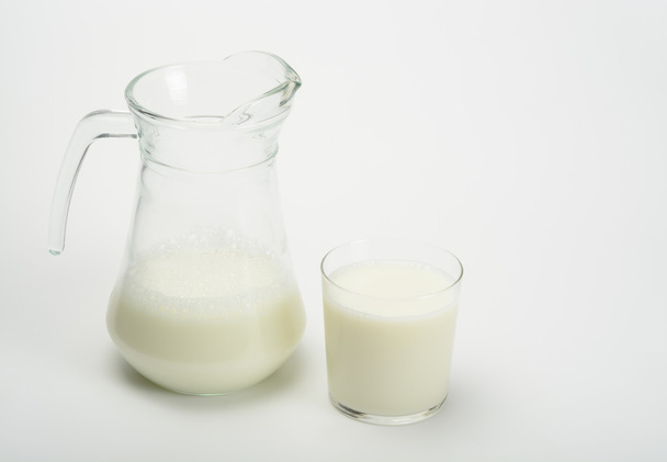 Glass of milk and jar - Foto, imagen