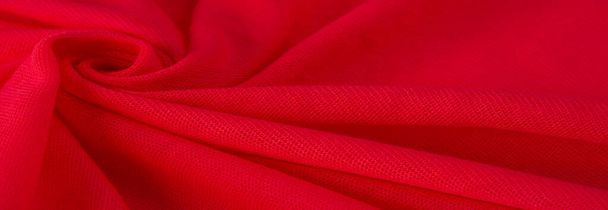 Rotes Tuch. abstrakter Hintergrund aus luxuriösem Stoff oder flüssiger Seidentextur aus Wellen oder welligen Falten. Hintergrund oder elegantes Tapetendesign. Baumwolltextur, natürlicher Stoff und Farbstoff, leuchtend rote Farbe. - Foto, Bild