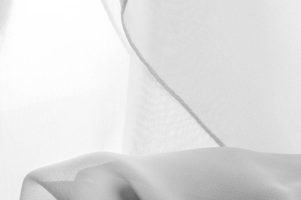 Textúra. minta.fehér selyem poliészter. Háttér szellem fehér selyem szövet. Texturált háttér készült átlátszó és könnyű szövet varrására ruhák. Textilpanoráma - Fotó, kép