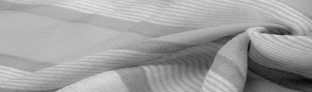 Текстура. Тло. Монохромна сіра шовкова тканина, фотографія або картина, розроблена або виконана в чорно-білому або в різних тонах лише одного кольору
. - Фото, зображення