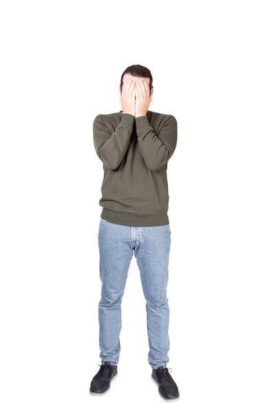 Full length portrait of disappointed young man, facepalm gesture, covering face with his hands. Depressed person suffering emotional breakdown and failure isolated on white background. - Photo, Image