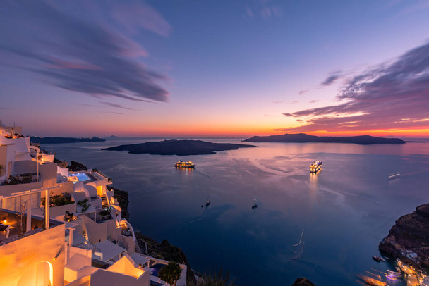 Amazing evening view of Santorini island. Picturesque spring sunset on the famous Greek resort Fira, Greece, Europe. Traveling concept background. Artistic style post processed photo. Summer vacation - Photo, Image