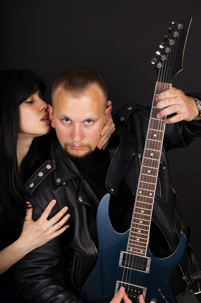 singer and guitarist on the black background - Foto, imagen
